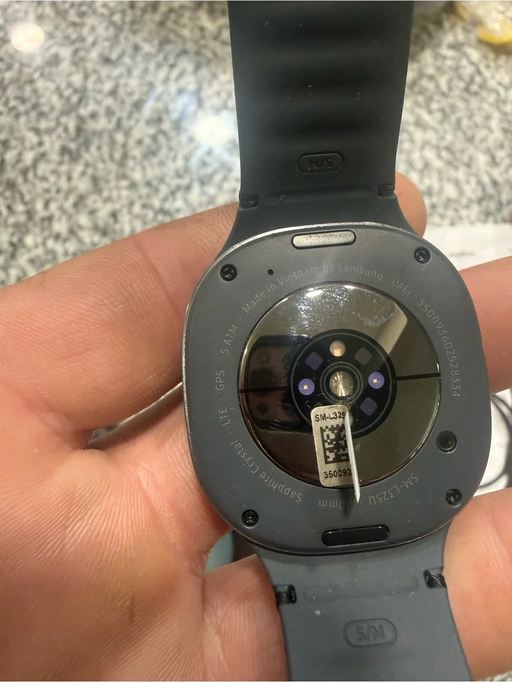 Samsung Gray Smartwatch with Black Charger Cable